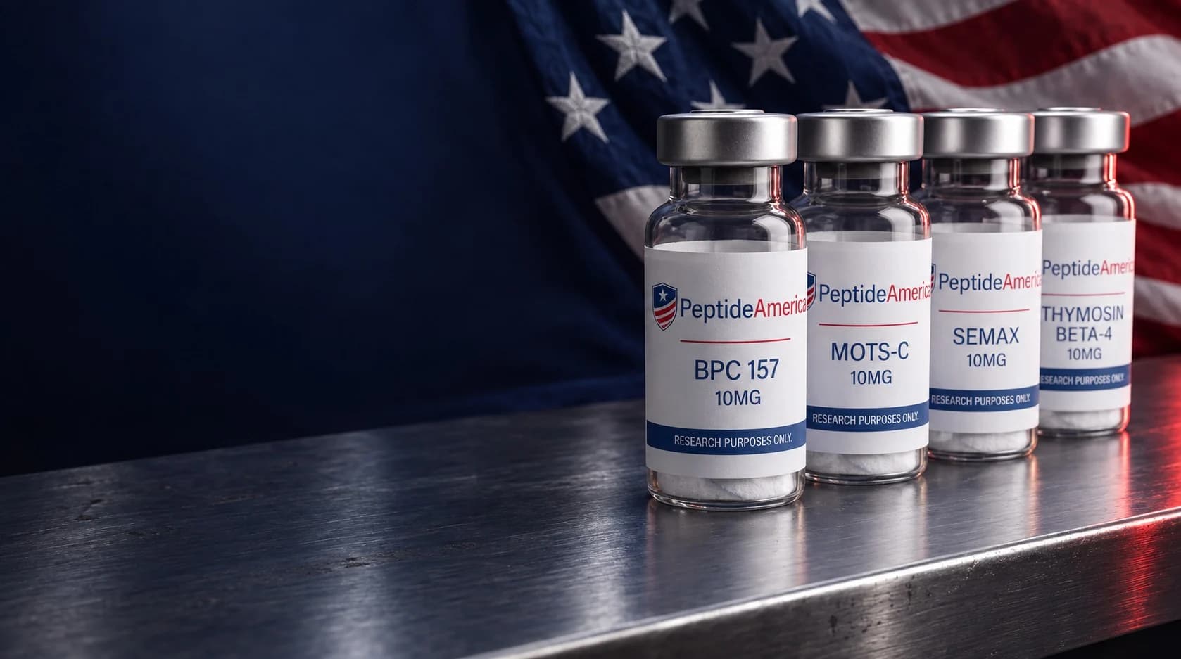 Four Peptide America research vials on steel with an American flag behind them
